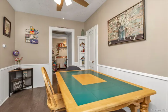 a room with pool table and windows