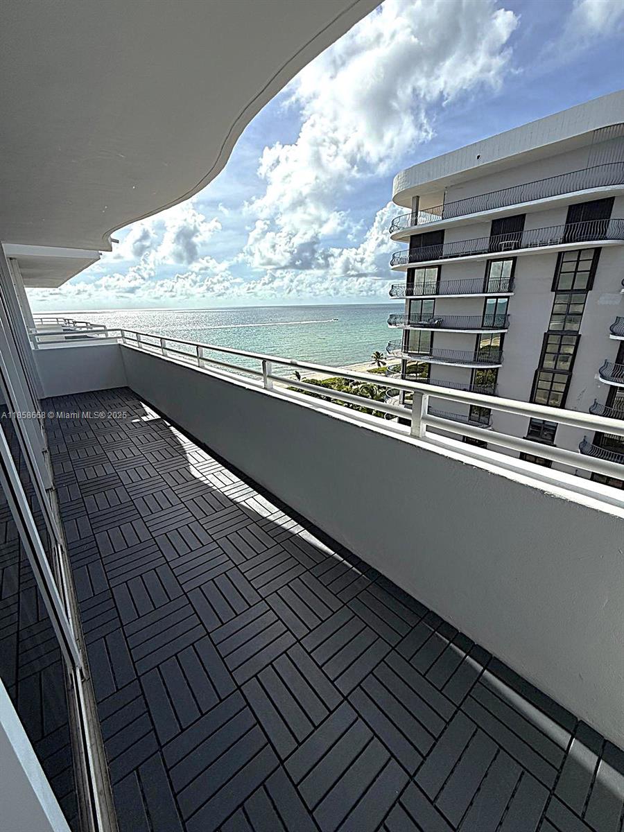 8911 Collins Avenue, Unit 1004 Surfside, FL 33154 - Photo 14 of 33 a view of balcony with furniture