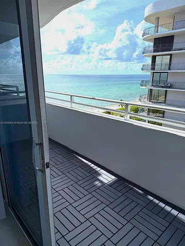 a view of a balcony with an outdoor space