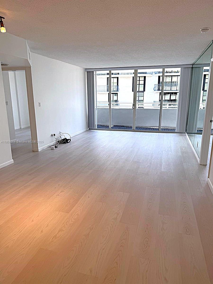 8911 Collins Avenue, Unit 1004 Surfside, FL 33154 - Photo 24 of 33 an empty room with entrance door