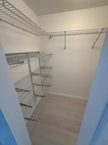 a view of a room with racks on the wall