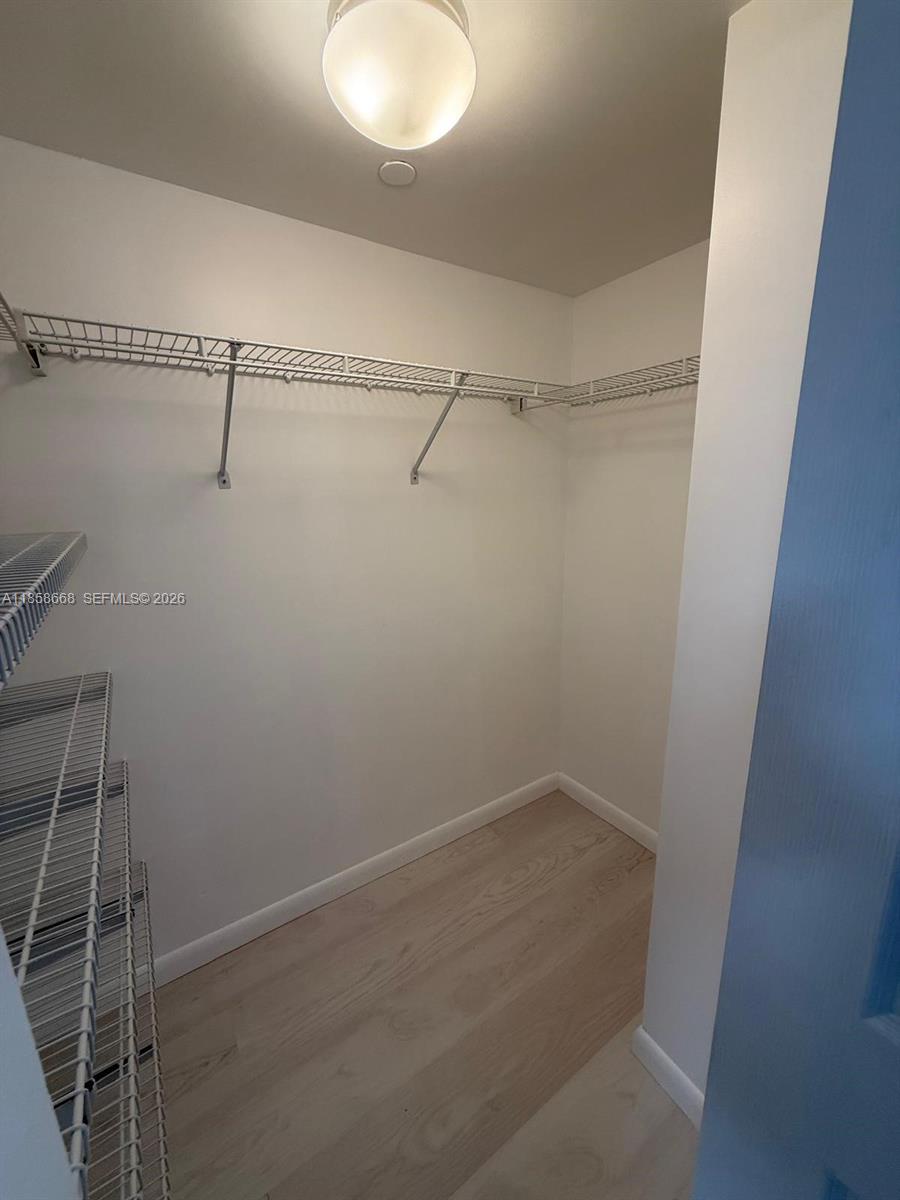 8911 Collins Avenue, Unit 1004 Surfside, FL 33154 - Photo 26 of 38 a view of a room with racks on the wall