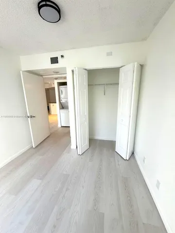 a living room with furniture and white walls