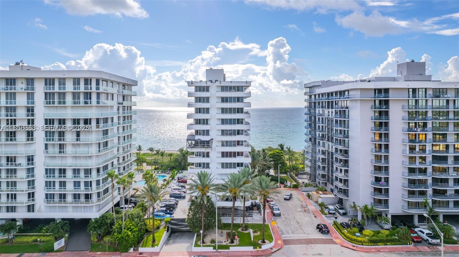 8911 Collins Avenue, Unit 1004 Surfside, FL 33154 - Photo 3 of 38 a view of a city with tall buildings