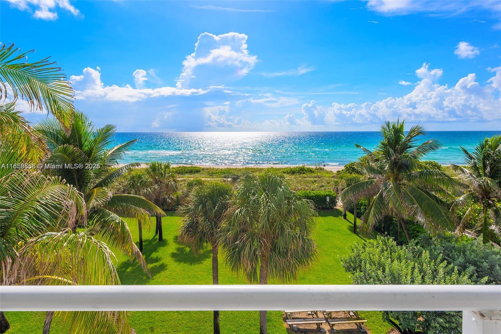 8911 Collins Avenue, Unit 1004 Surfside, FL 33154 - Photo 9 of 33 a view of a lake from a balcony