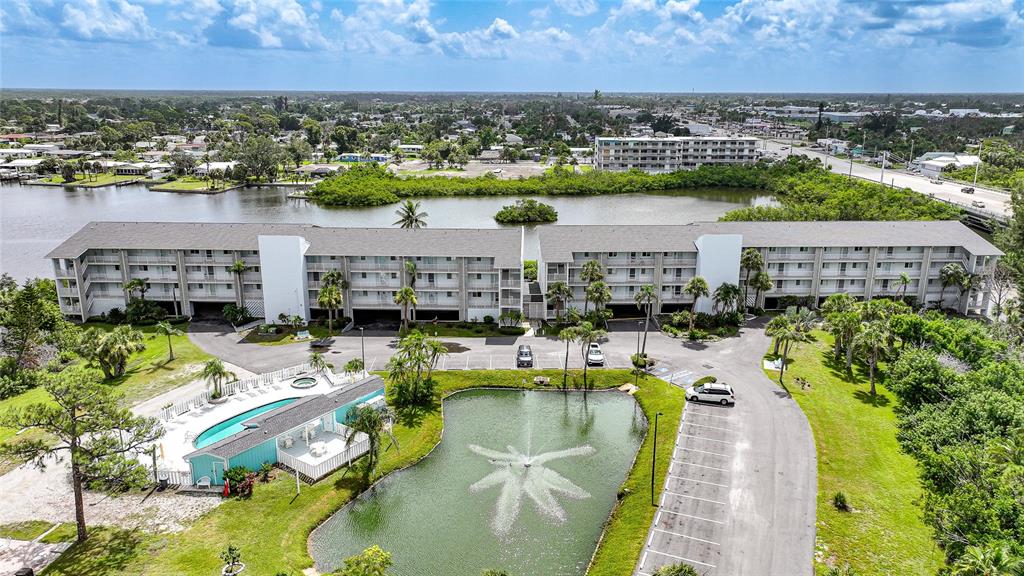 1401 South McCall Road, Unit 201B Englewood, FL 34223 - Photo 1 of 1 an aerial view of a house with a lake view