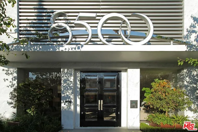 a front view of a house with outdoor space