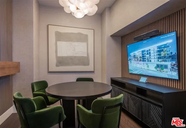 a dining room with furniture and a window