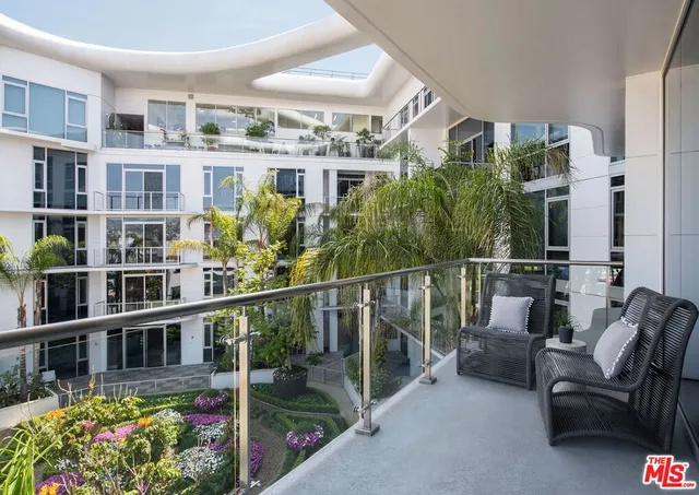a view of a balcony with chairs