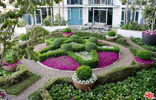 a view of a house with a yard and garden