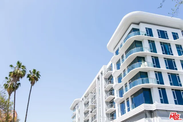 a front view of multi story residential apartment building