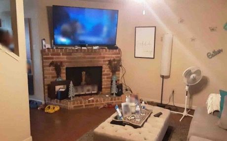 10113 Spring Pl Drive Houston, TX 77070 - Photo 5 of 11 a living room with furniture and a fireplace