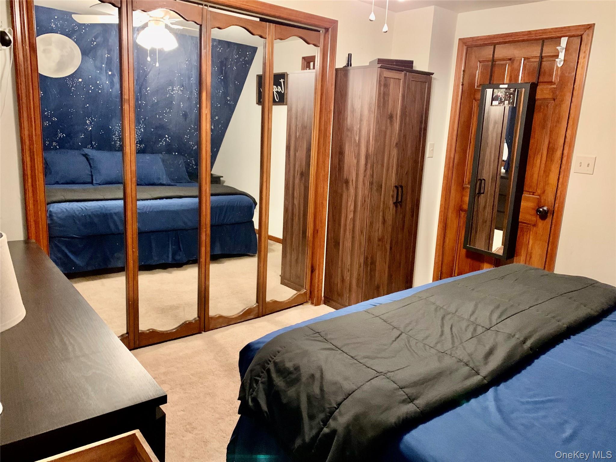 1 Library Road Tuxedo Park, NY 10987 - Photo 28 of 28 a bedroom with a large bed and a large window