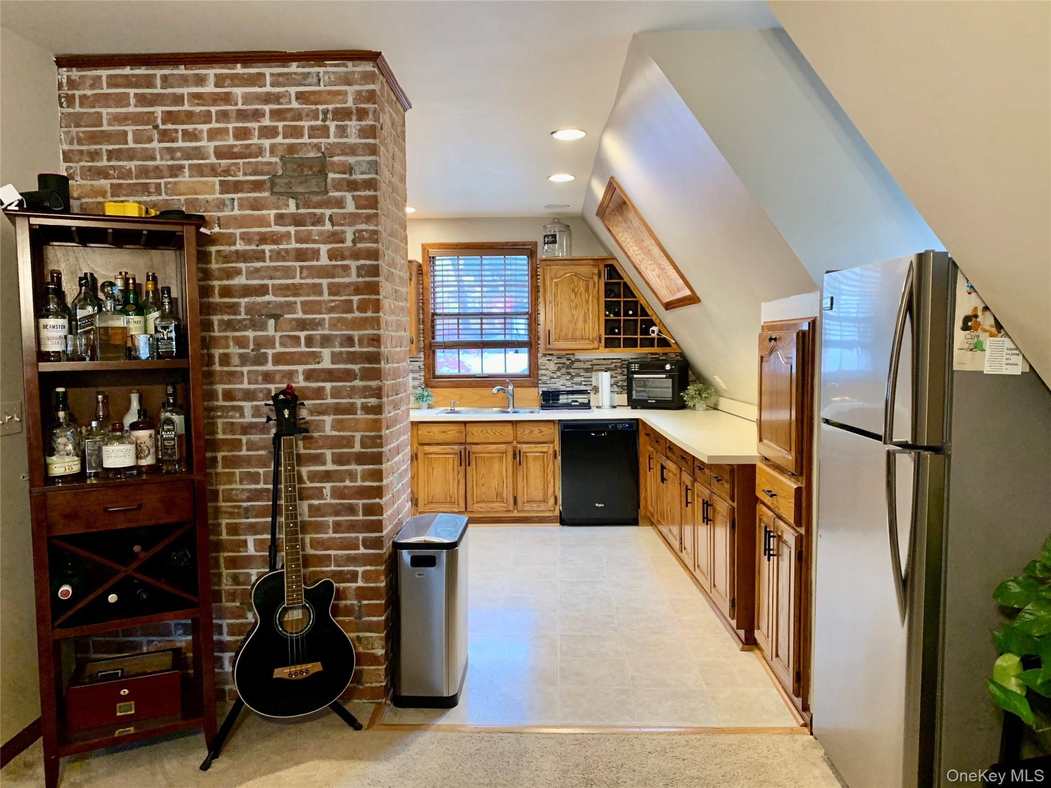 1 Library Road Tuxedo Park, NY 10987 - Photo 5 of 28 a kitchen with stainless steel appliances kitchen island granite countertop a refrigerator and a stove top oven