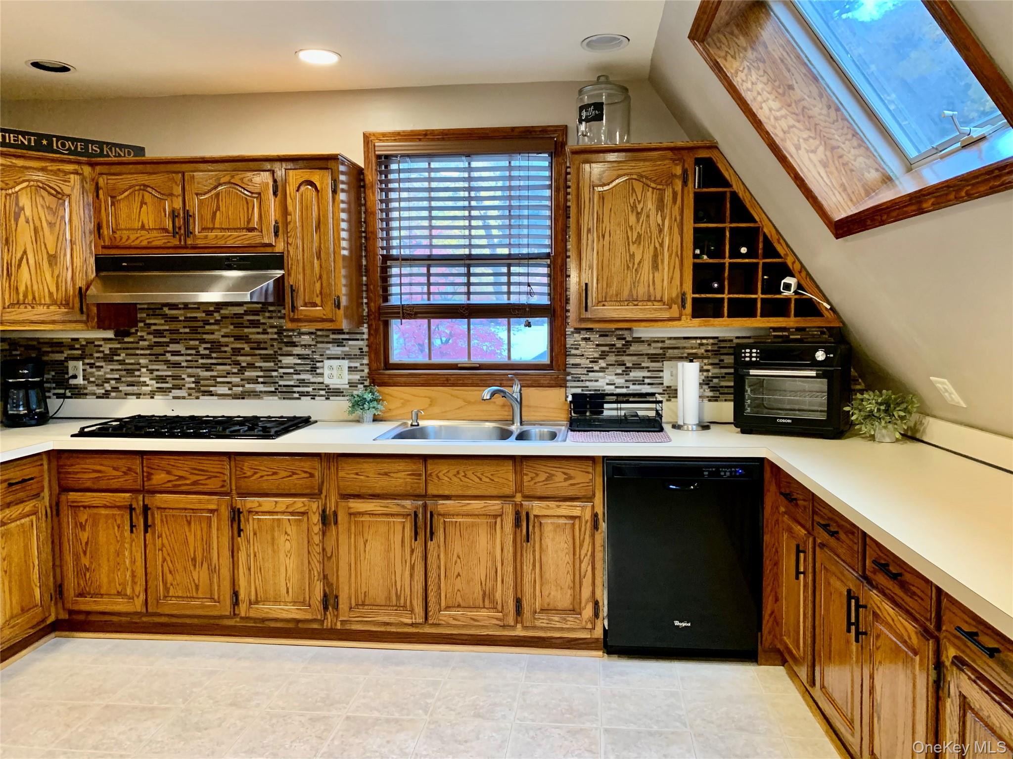 1 Library Road Tuxedo Park, NY 10987 - Photo 7 of 28 a kitchen with a sink and cabinets