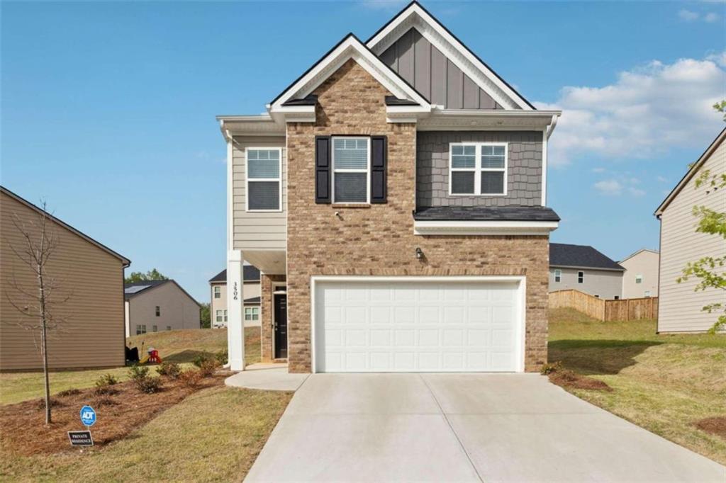 3506 Sycamore Bend Decatur, GA 30034 - Photo 1 of 1 a front view of a house with a yard and garage