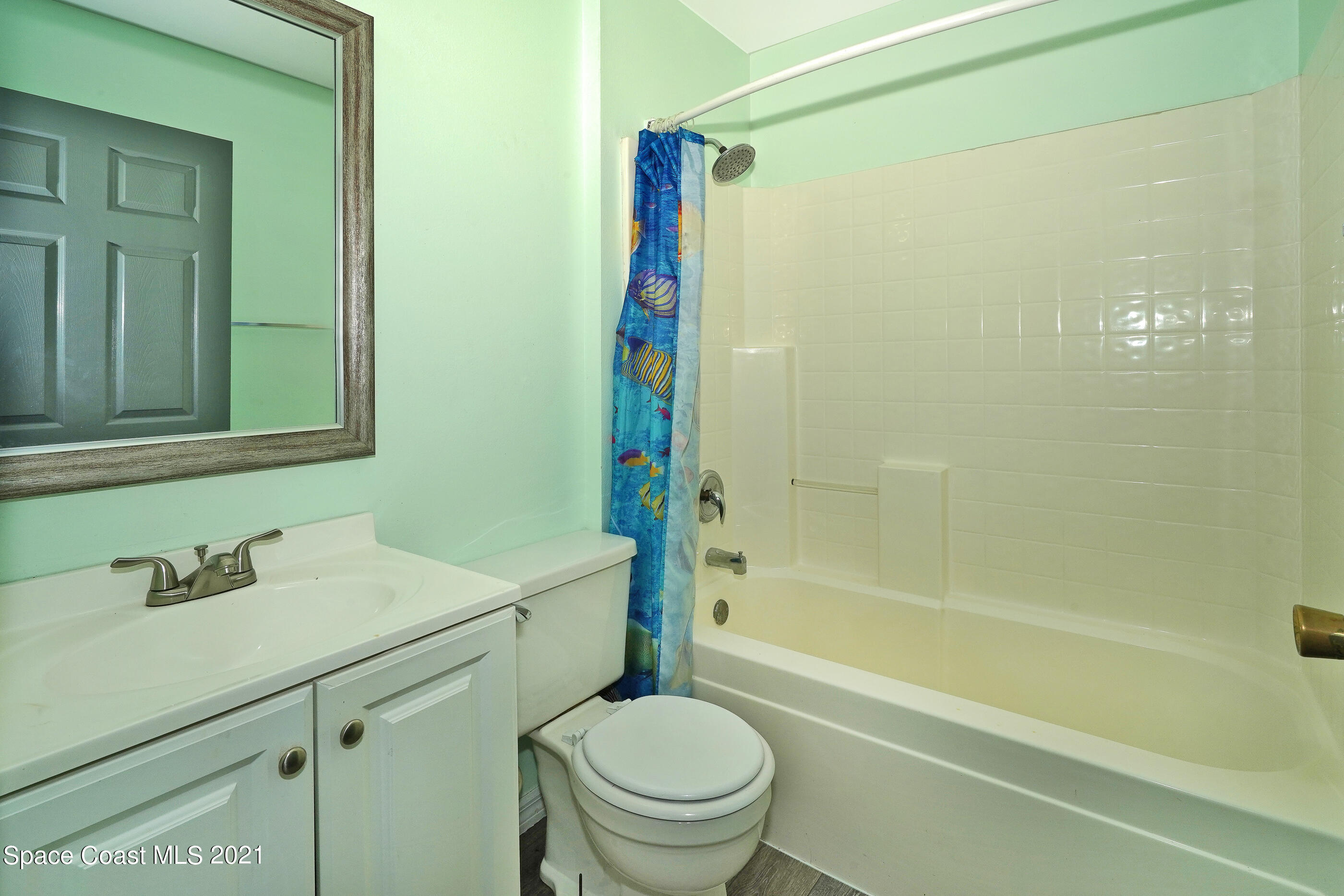 905 Macco Road Cocoa, FL 32927 - Photo 15 of 27 a bathroom with a sink a toilet and shower