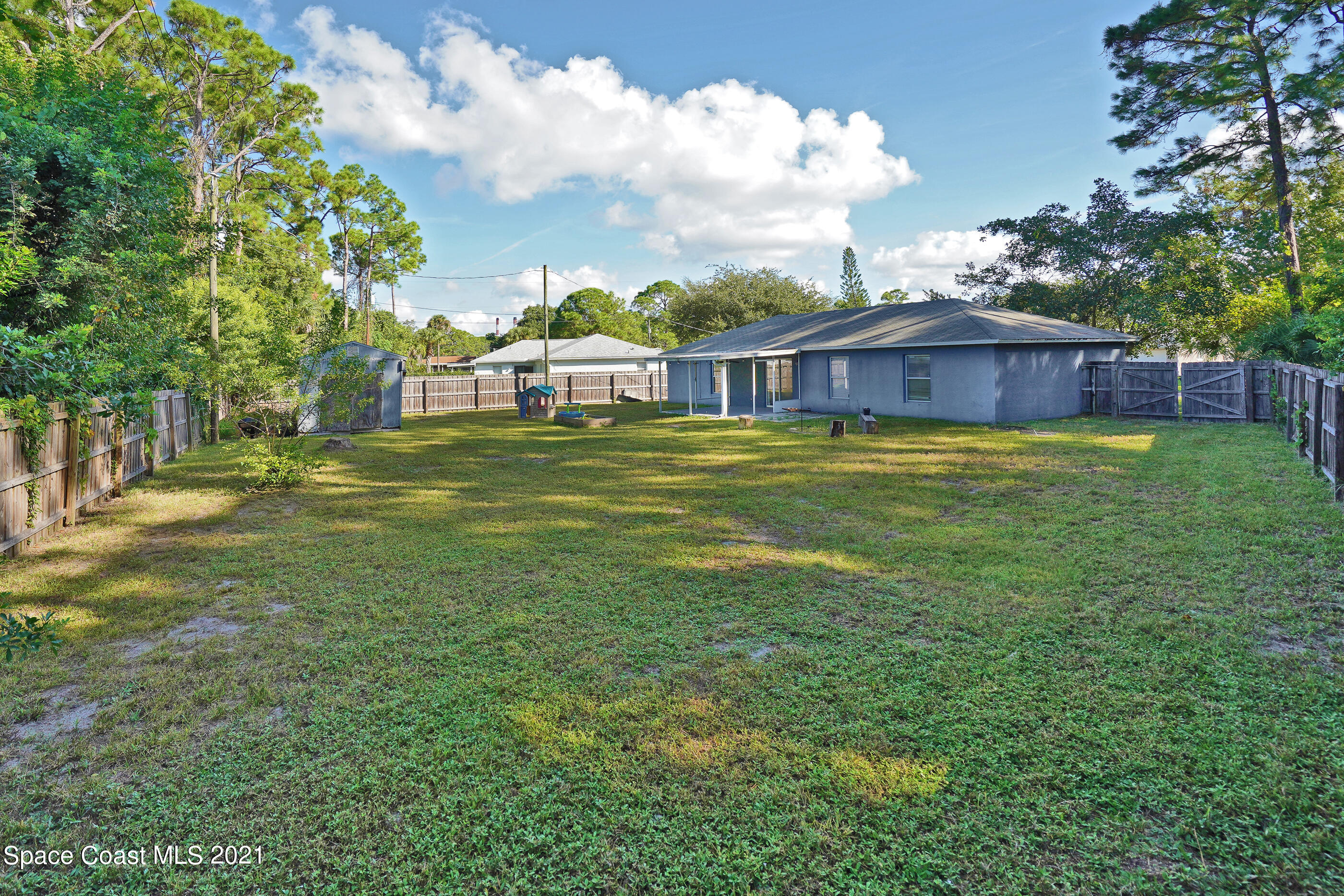 905 Macco Road Cocoa, FL 32927 - Photo 18 of 27 a front view of a house with a yard