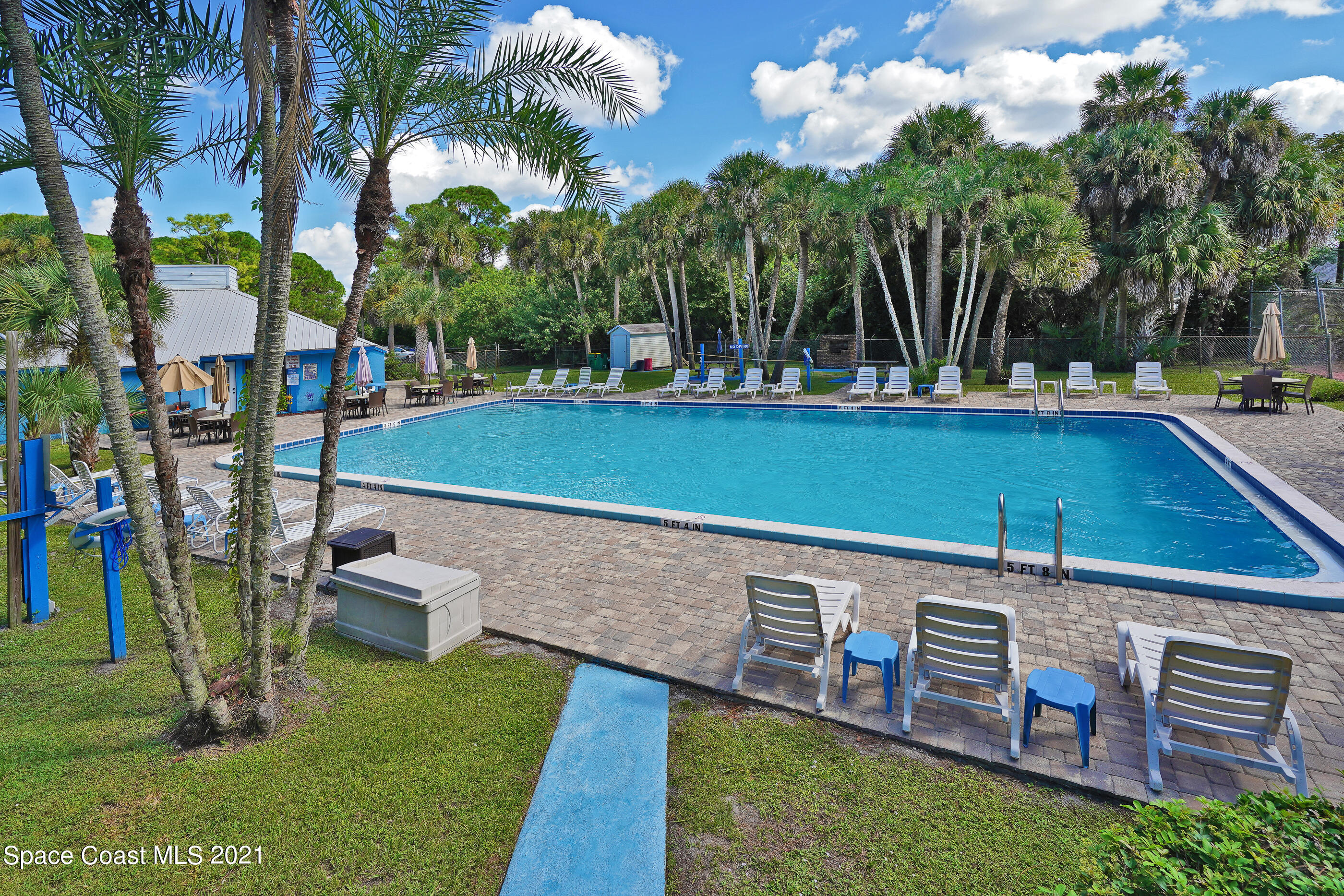 905 Macco Road Cocoa, FL 32927 - Photo 25 of 27 a view of a chairs and table in the yard