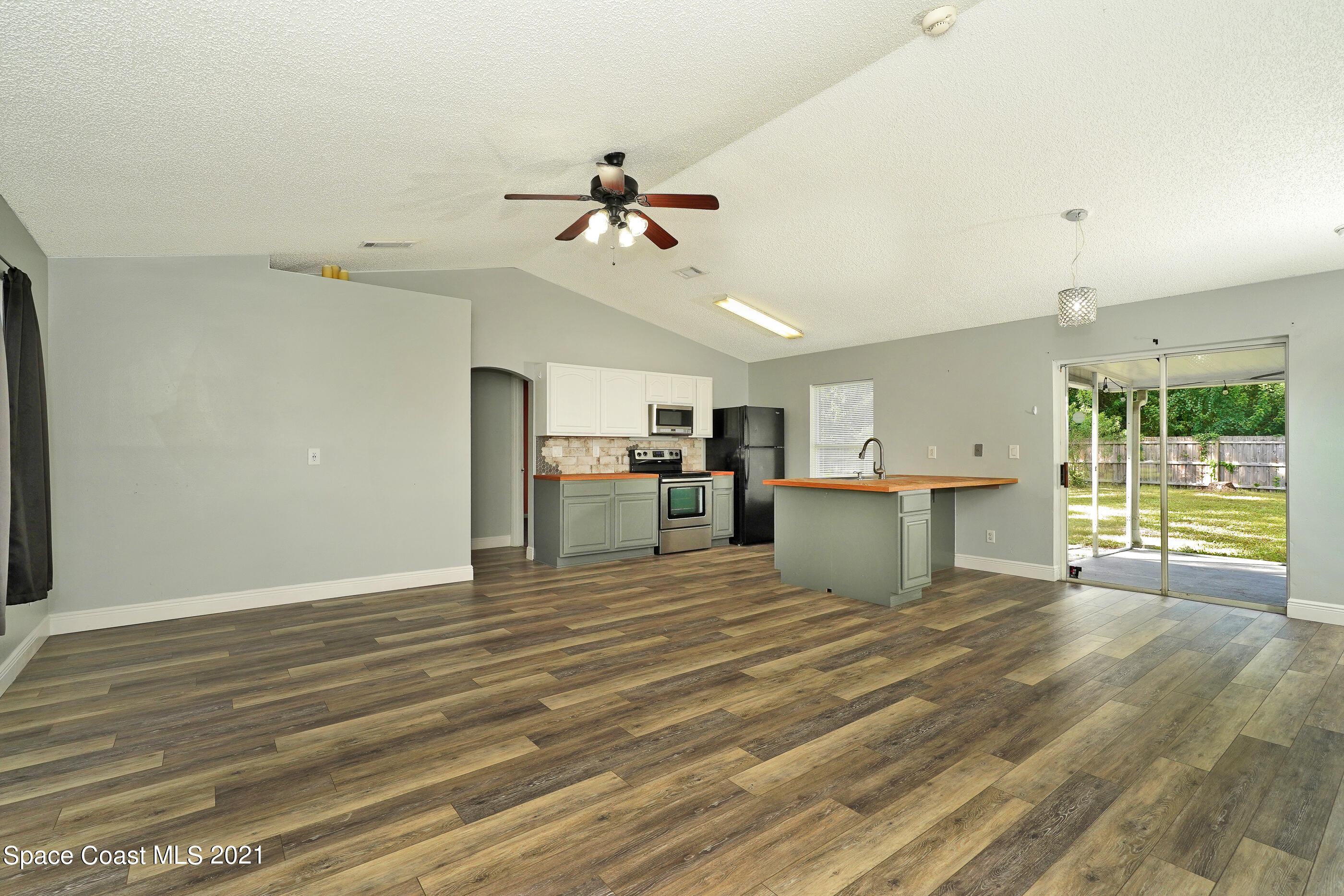 905 Macco Road Cocoa, FL 32927 - Photo 6 of 27 a view of a kitchen with microwave and cabinets