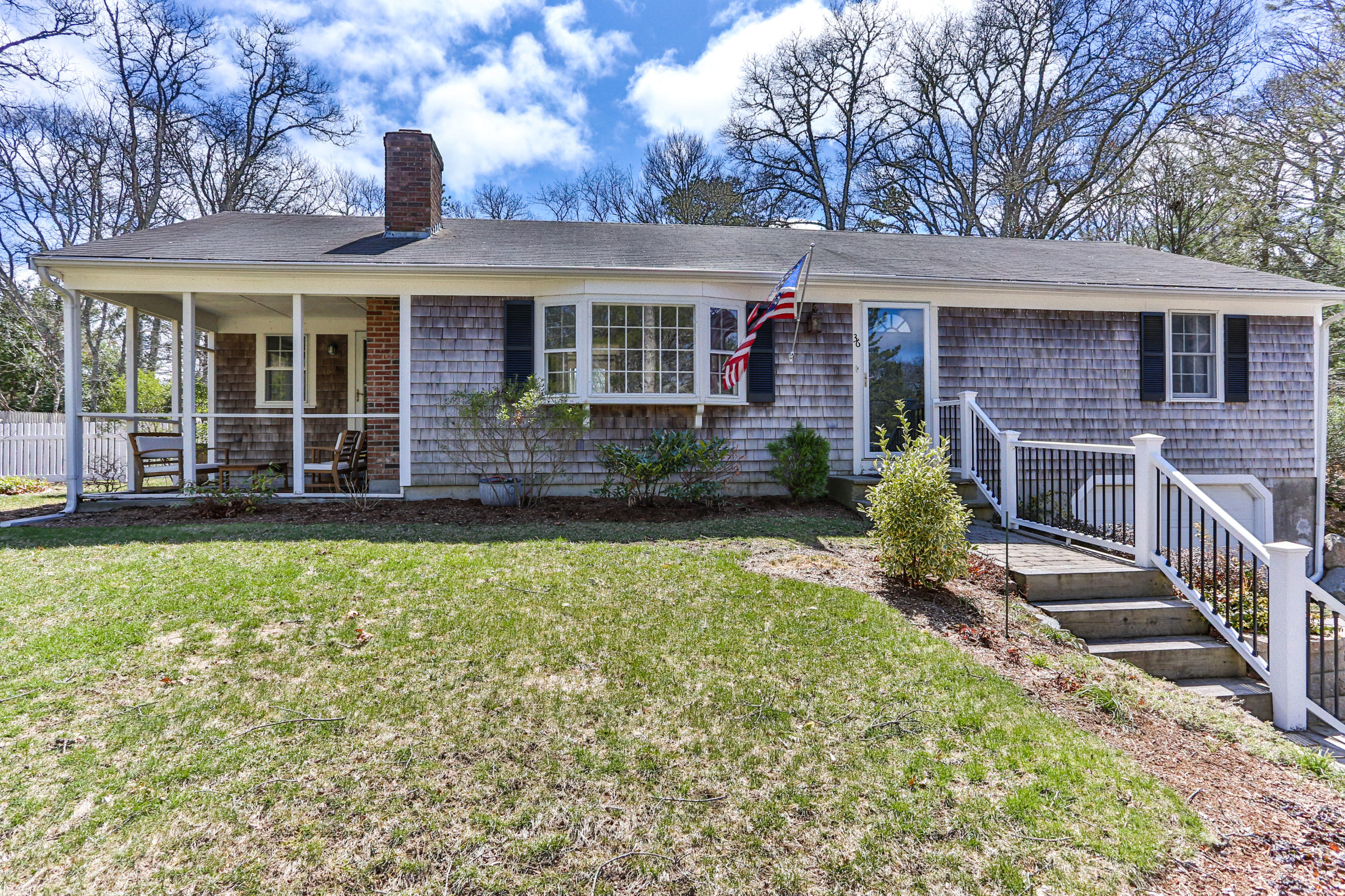 front view of a house with a yard