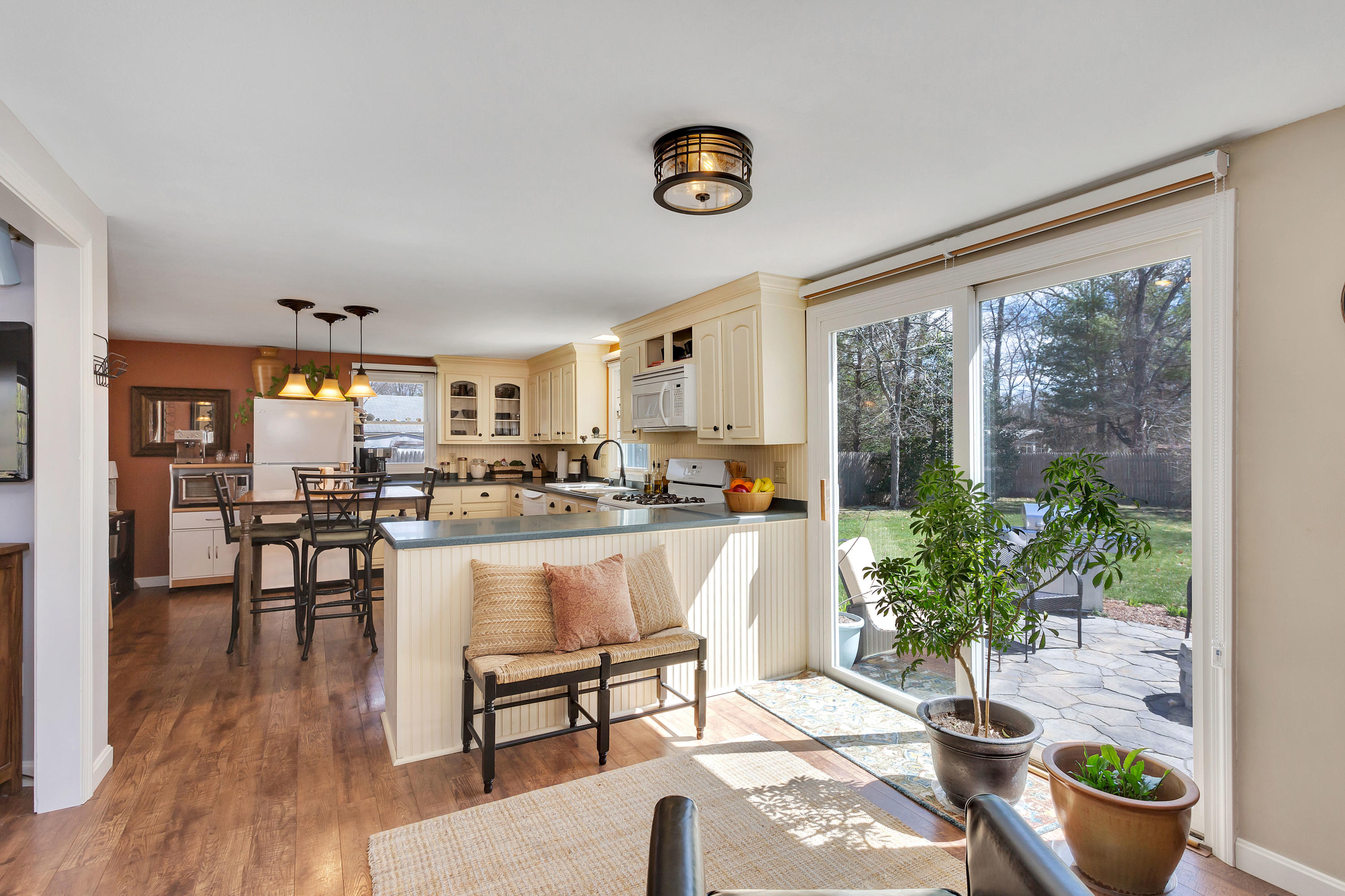 36 Scituate Road Mashpee, MA 02649 - Photo 11 of 36 a living room with furniture and a potted plant
