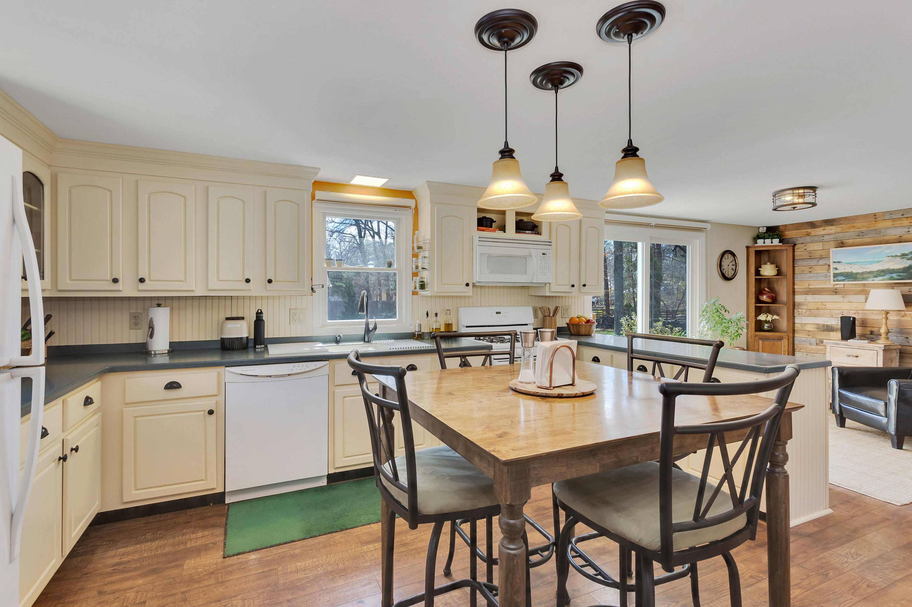36 Scituate Road Mashpee, MA 02649 - Photo 13 of 36 a kitchen with a dining table and chairs