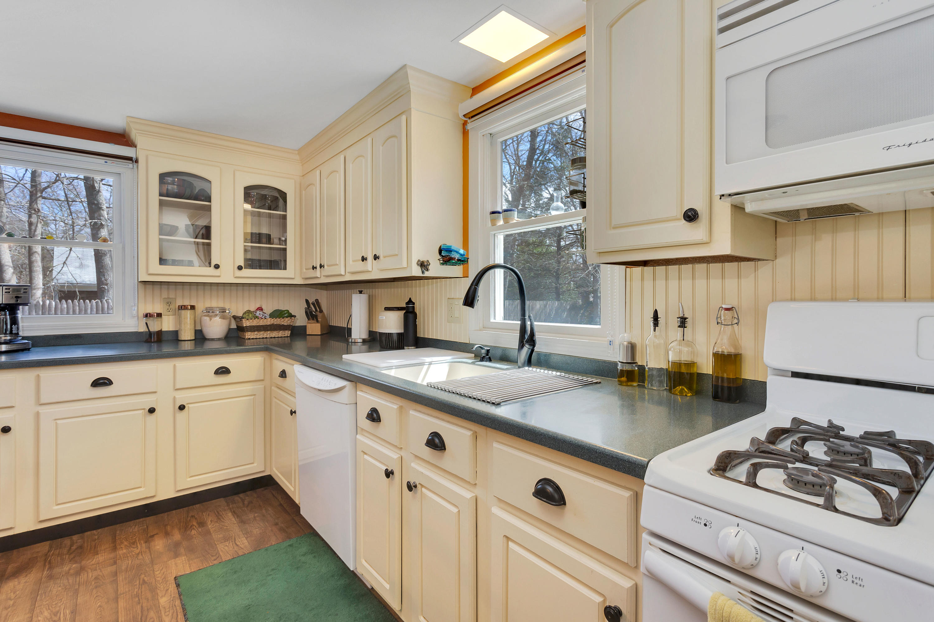 36 Scituate Road Mashpee, MA 02649 - Photo 14 of 36 a kitchen with stainless steel appliances granite countertop a stove sink and cabinets