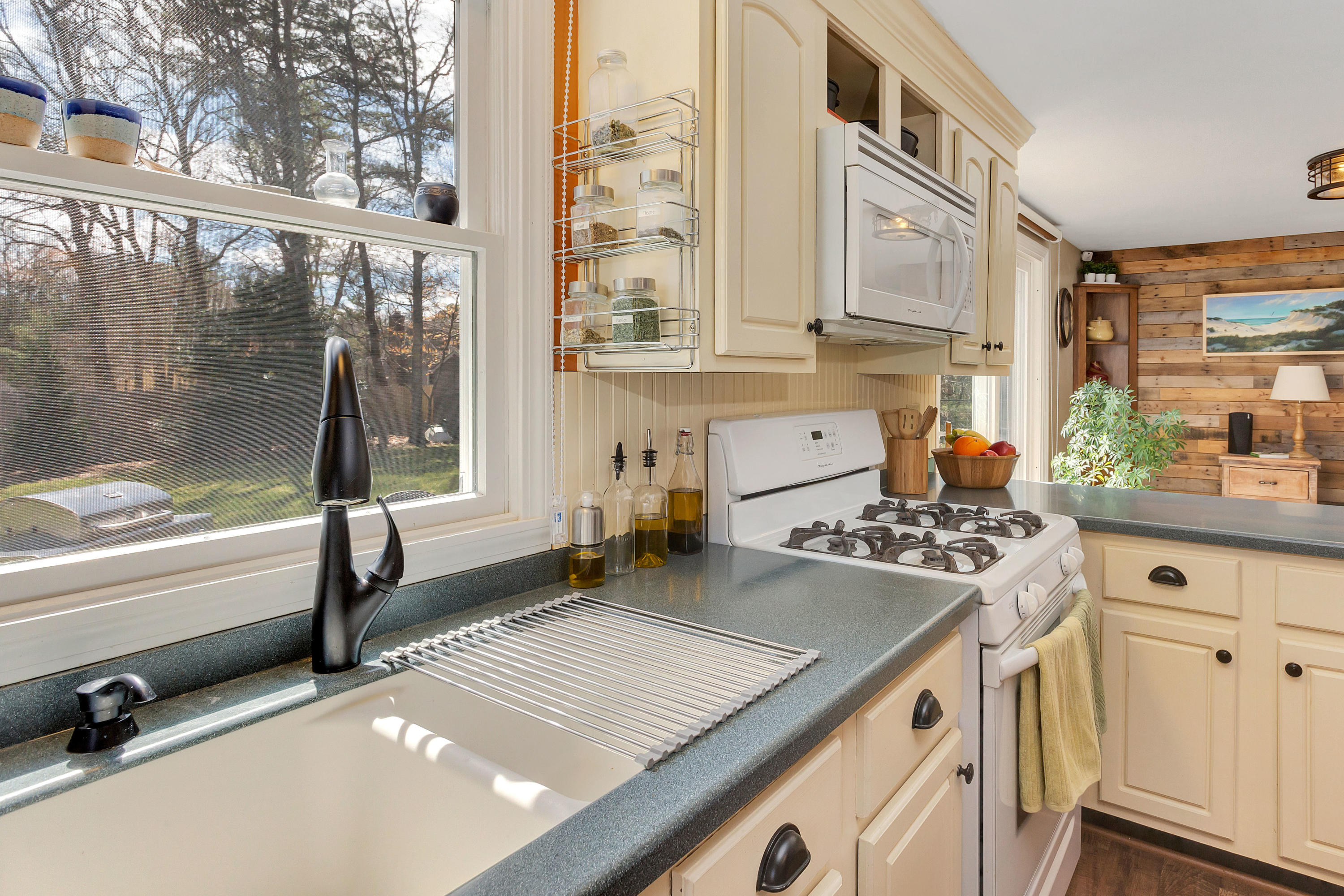 36 Scituate Road Mashpee, MA 02649 - Photo 15 of 36 a kitchen that has a sink and a stove