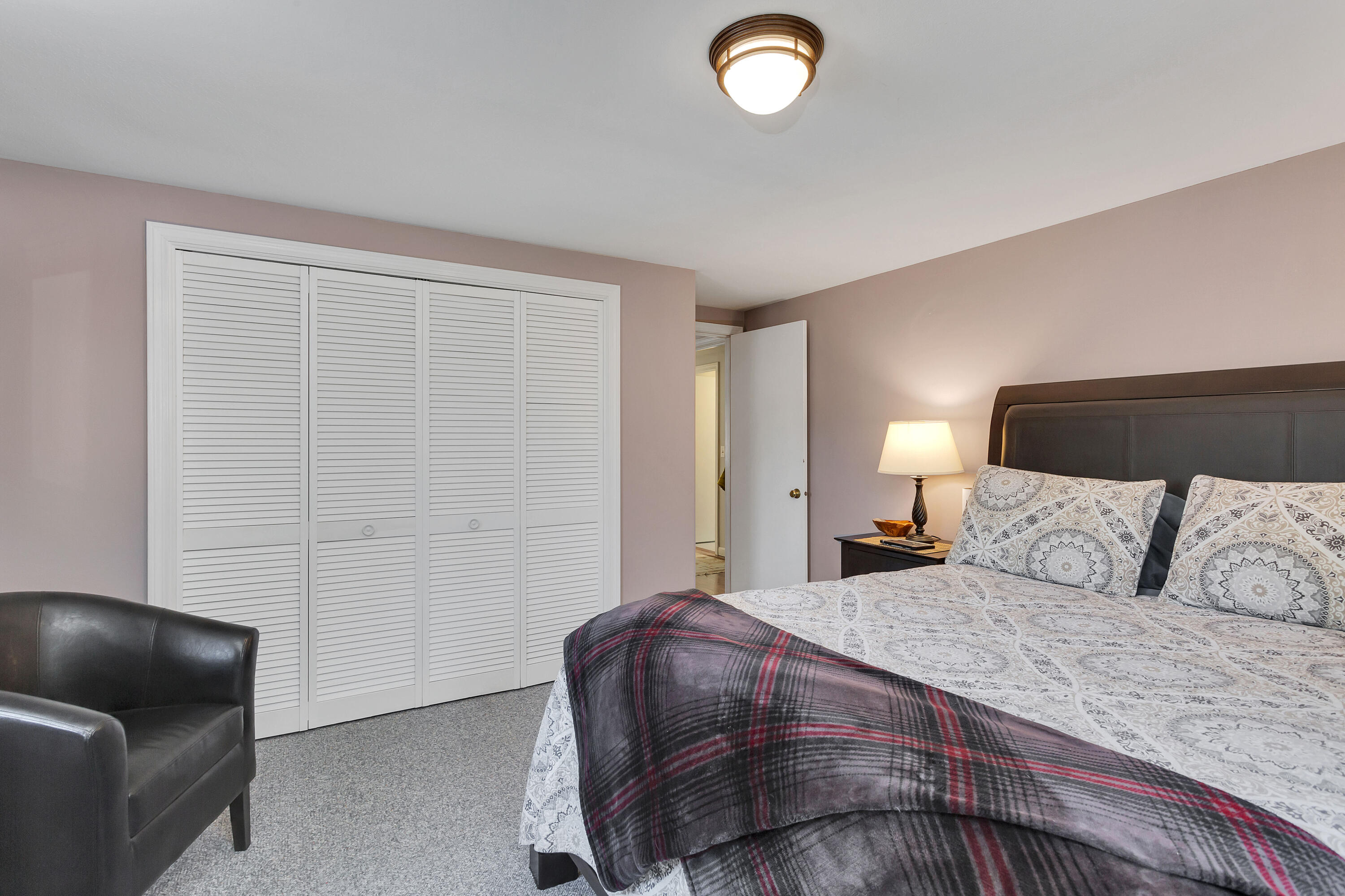 36 Scituate Road Mashpee, MA 02649 - Photo 21 of 36 a bedroom with a bed and a chair