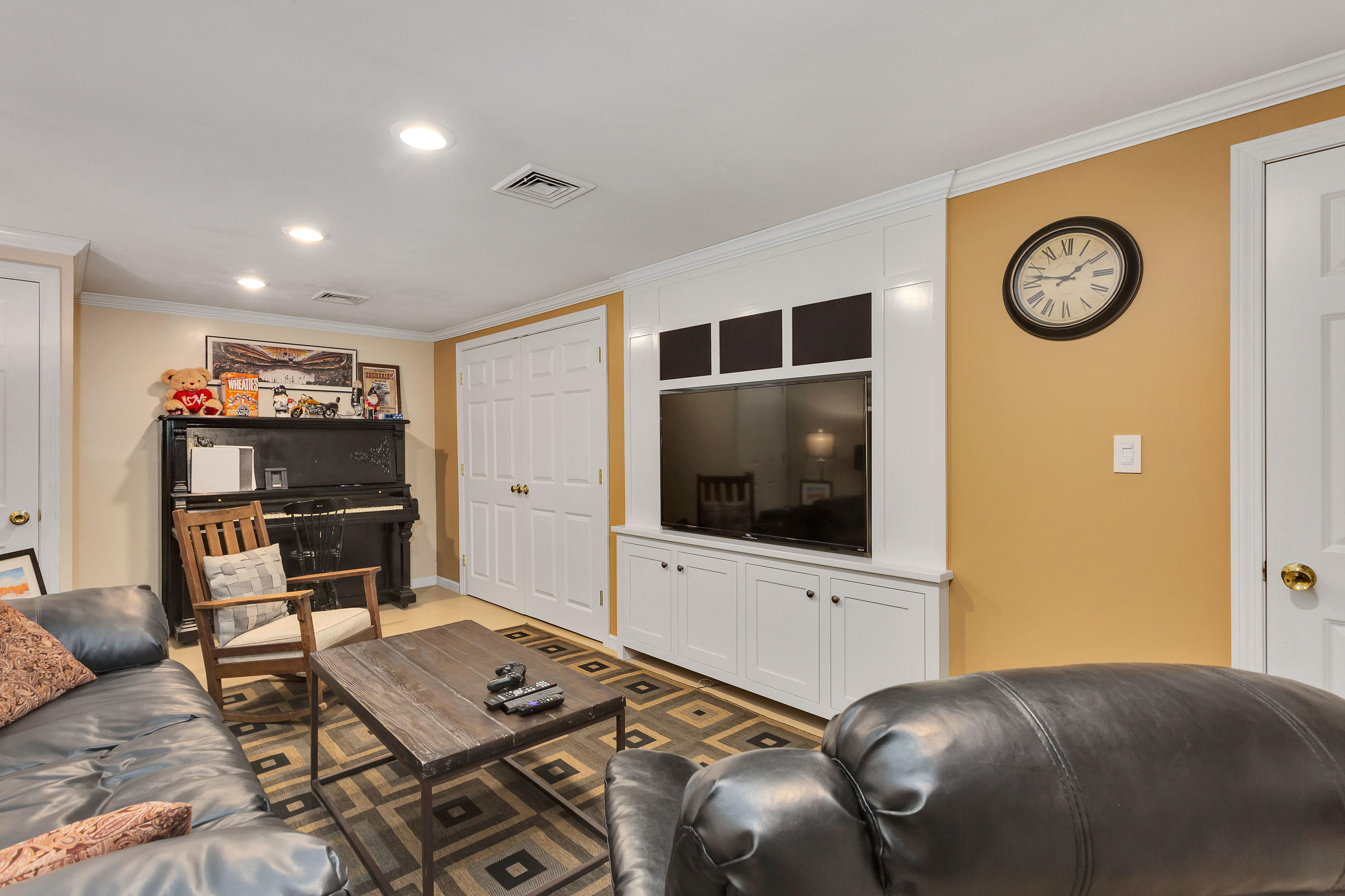 36 Scituate Road Mashpee, MA 02649 - Photo 22 of 36 a living room with furniture and a flat screen tv