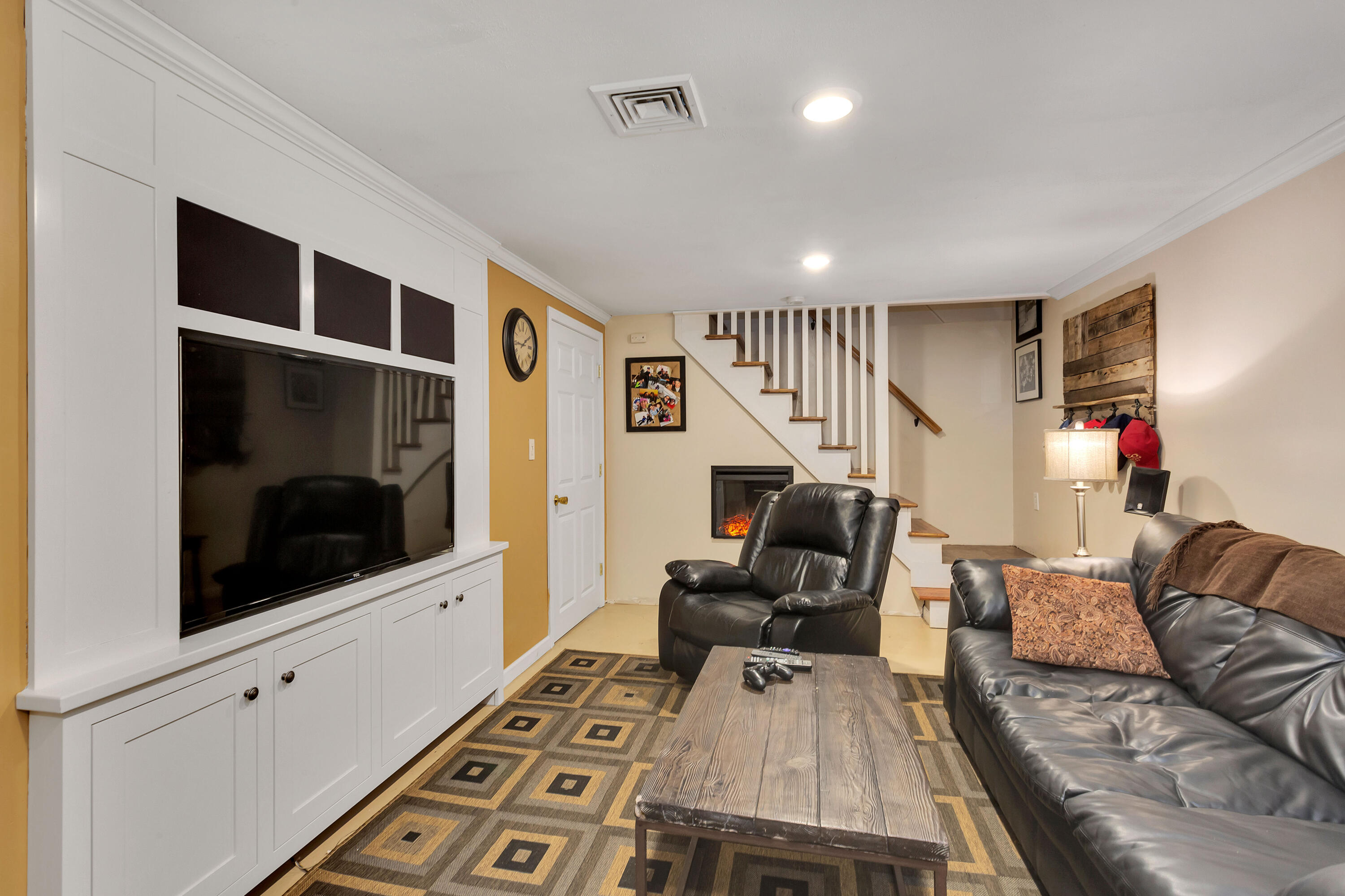 36 Scituate Road Mashpee, MA 02649 - Photo 23 of 36 a living room with furniture and a flat screen tv