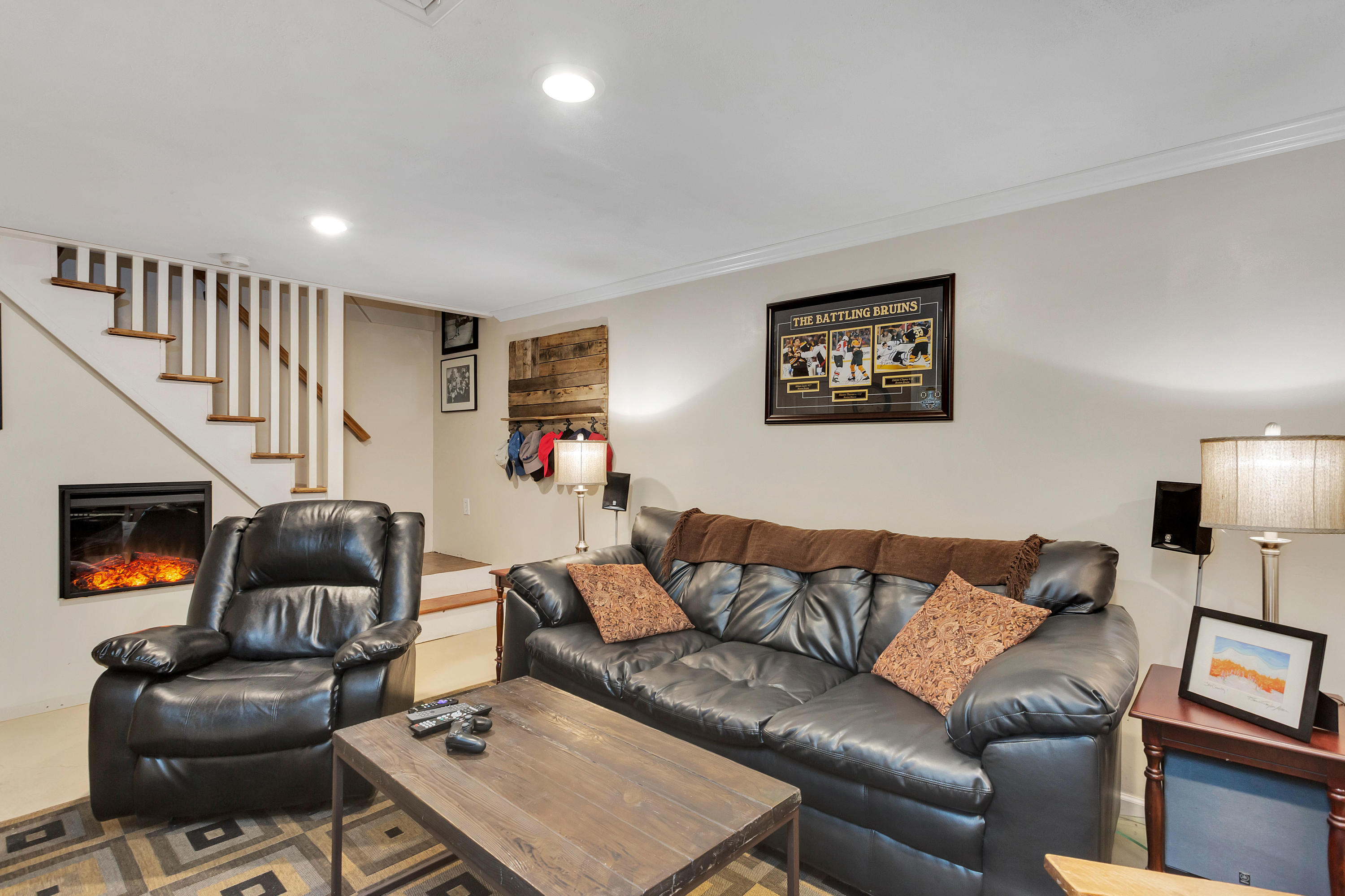 36 Scituate Road Mashpee, MA 02649 - Photo 24 of 36 a living room with furniture and a flat screen tv