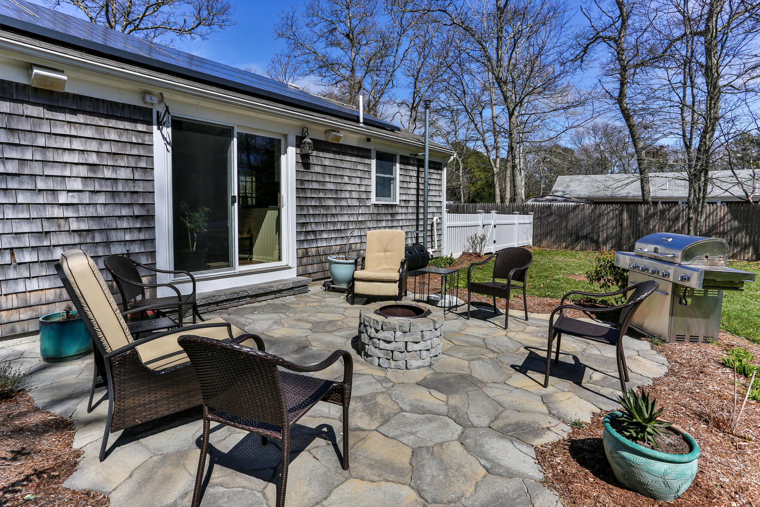 36 Scituate Road Mashpee, MA 02649 - Photo 28 of 36 a view of backyard with outdoor seating and plants