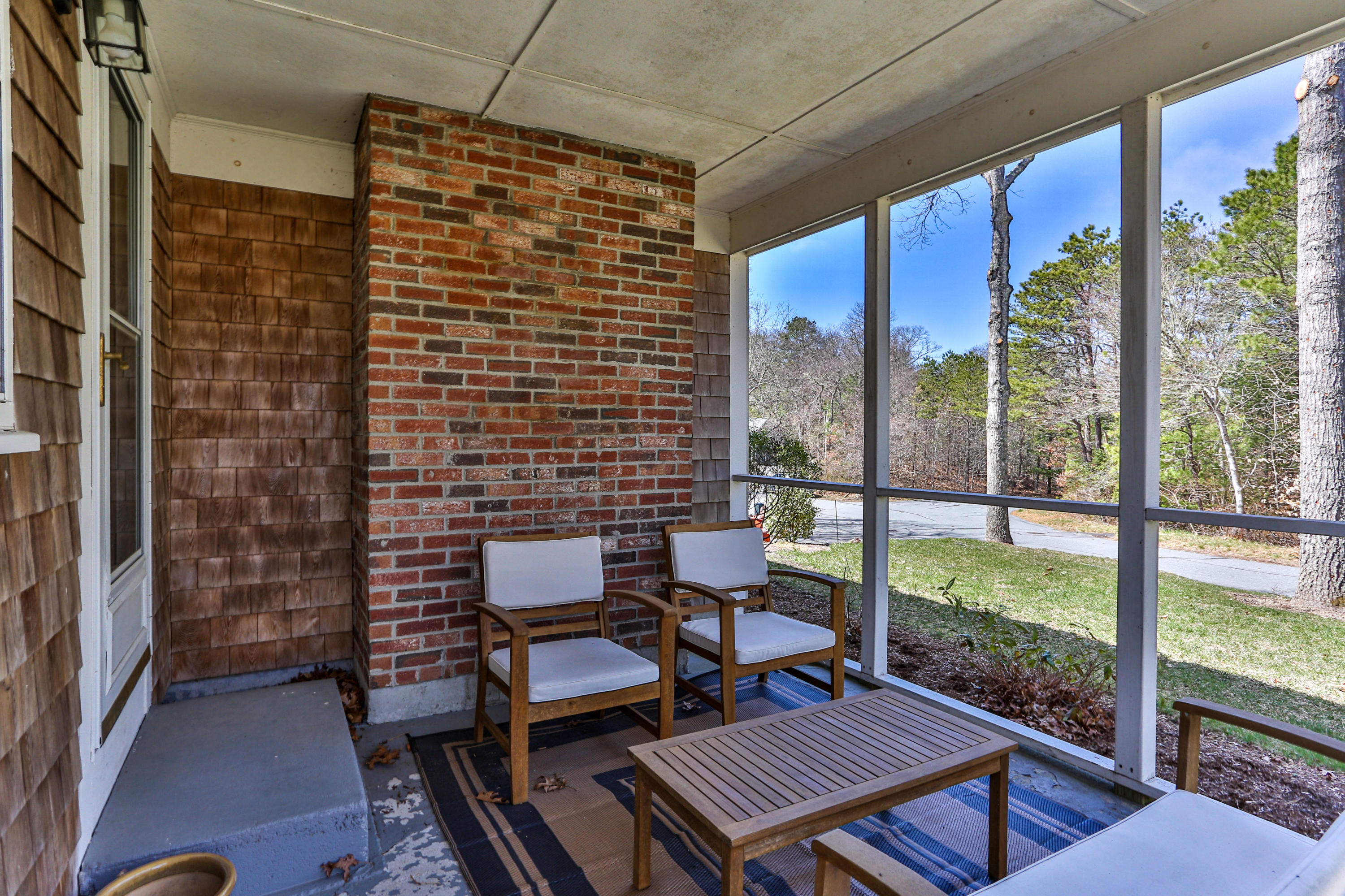 36 Scituate Road Mashpee, MA 02649 - Photo 33 of 36 a balcony view with a couple of chairs