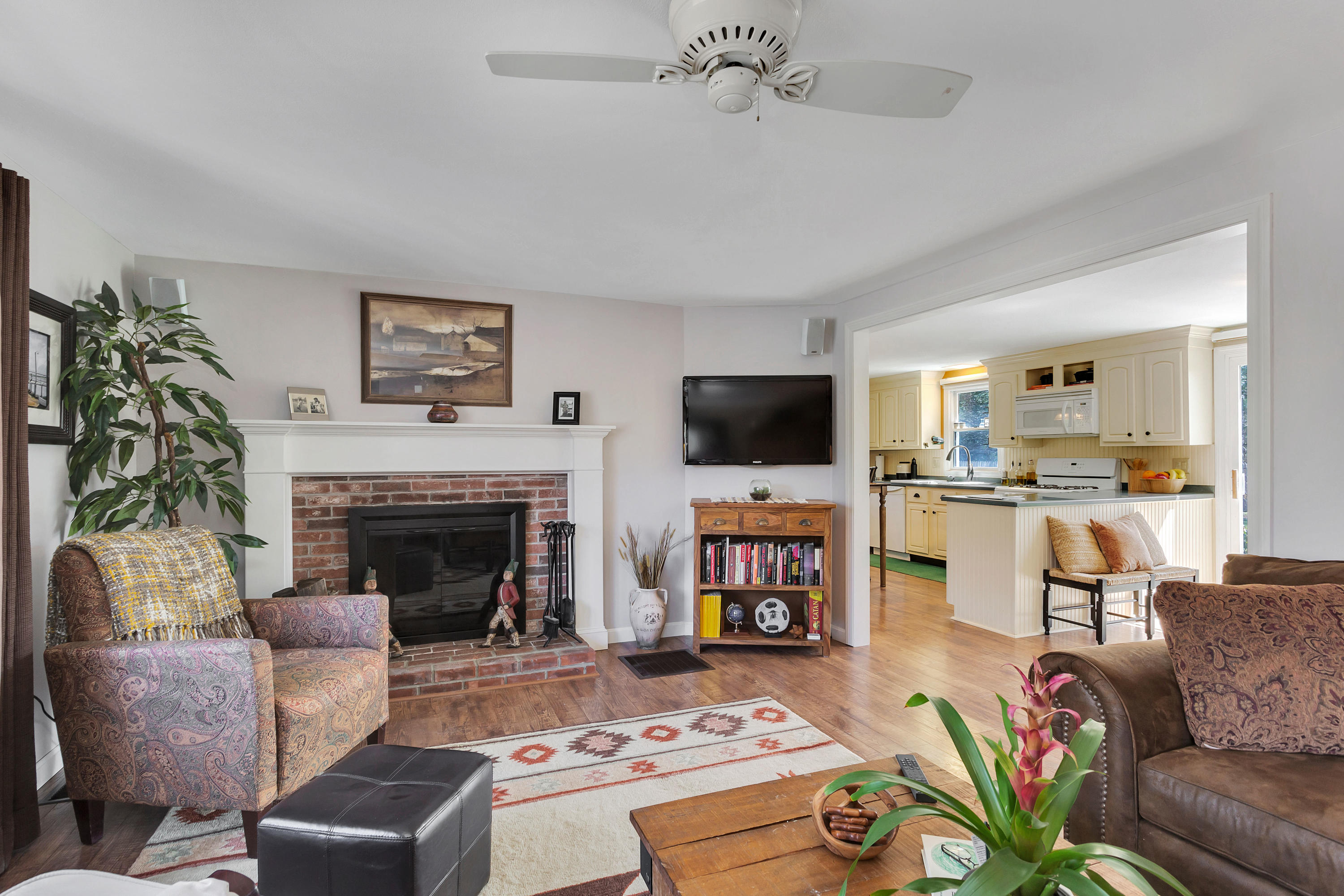 36 Scituate Road Mashpee, MA 02649 - Photo 5 of 36 a living room with furniture fireplace and a flat screen tv
