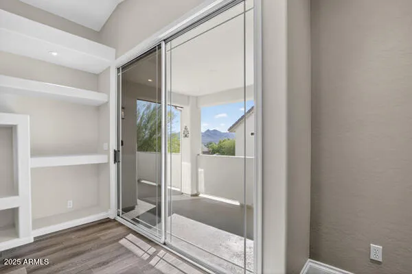 a bathroom with a glass shower door