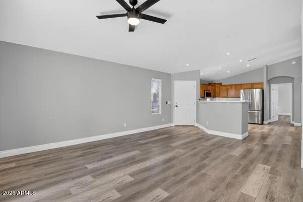 a view of a kitchen with a sink and a refrigerator