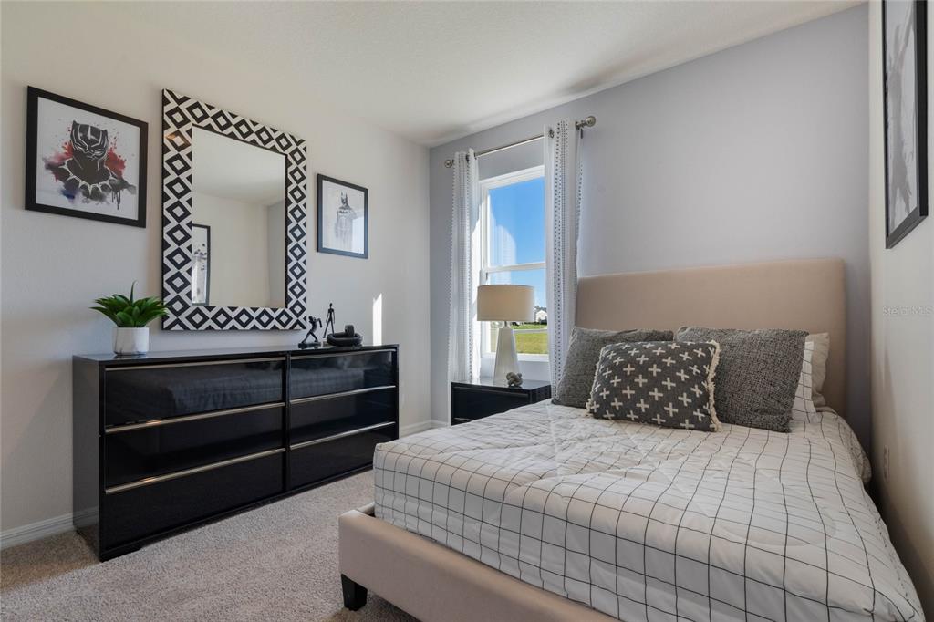 4201 Evernia Road Tavares, FL 32778 - Photo 19 of 25 a bedroom with a bed and a window