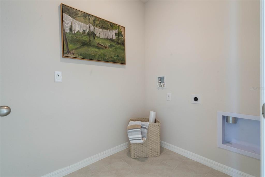 4201 Evernia Road Tavares, FL 32778 - Photo 25 of 25 a white toilet sitting next to a white walls