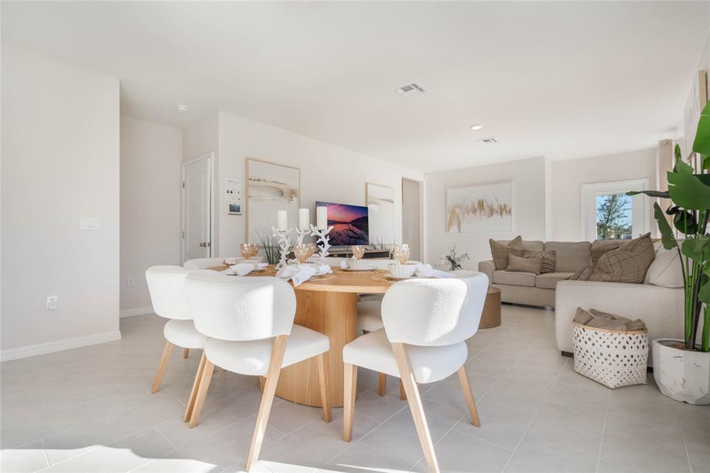 4201 Evernia Road Tavares, FL 32778 - Photo 3 of 25 a view of a dining room with furniture and a livingroom