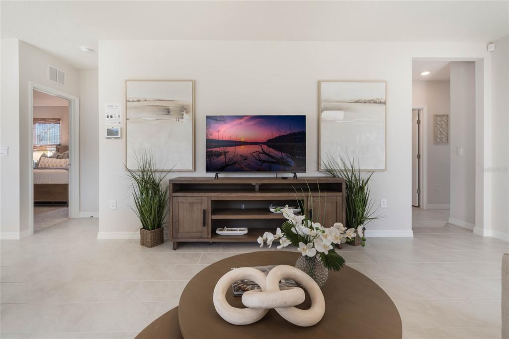 4201 Evernia Road Tavares, FL 32778 - Photo 6 of 25 a living room with furniture and a fireplace