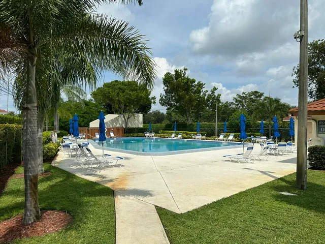 a view of a swimming pool with a patio
