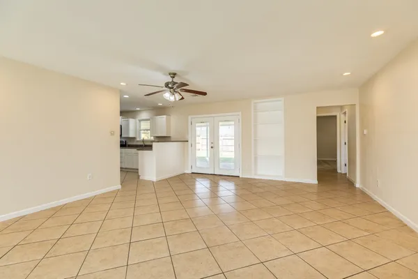 a view of a kitchen with a sink and cabinets