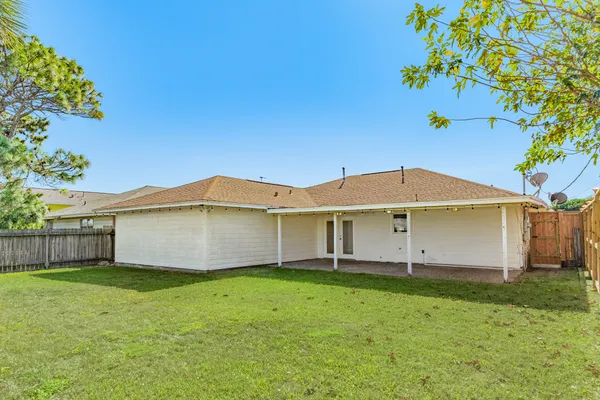 a big house with a big yard and large tree