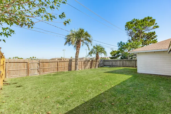 a garden with trees in front of it