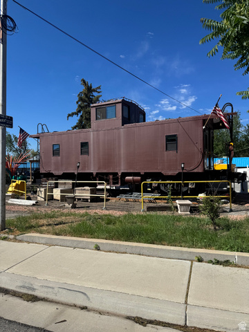 47 B Street Helper, UT 84526 - Photo 18 of 19 Historic caboose structure featuring a raised cupola, multiple window openings, and an exterior ladder