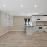 a kitchen with stainless steel appliances granite countertop a refrigerator sink and cabinets