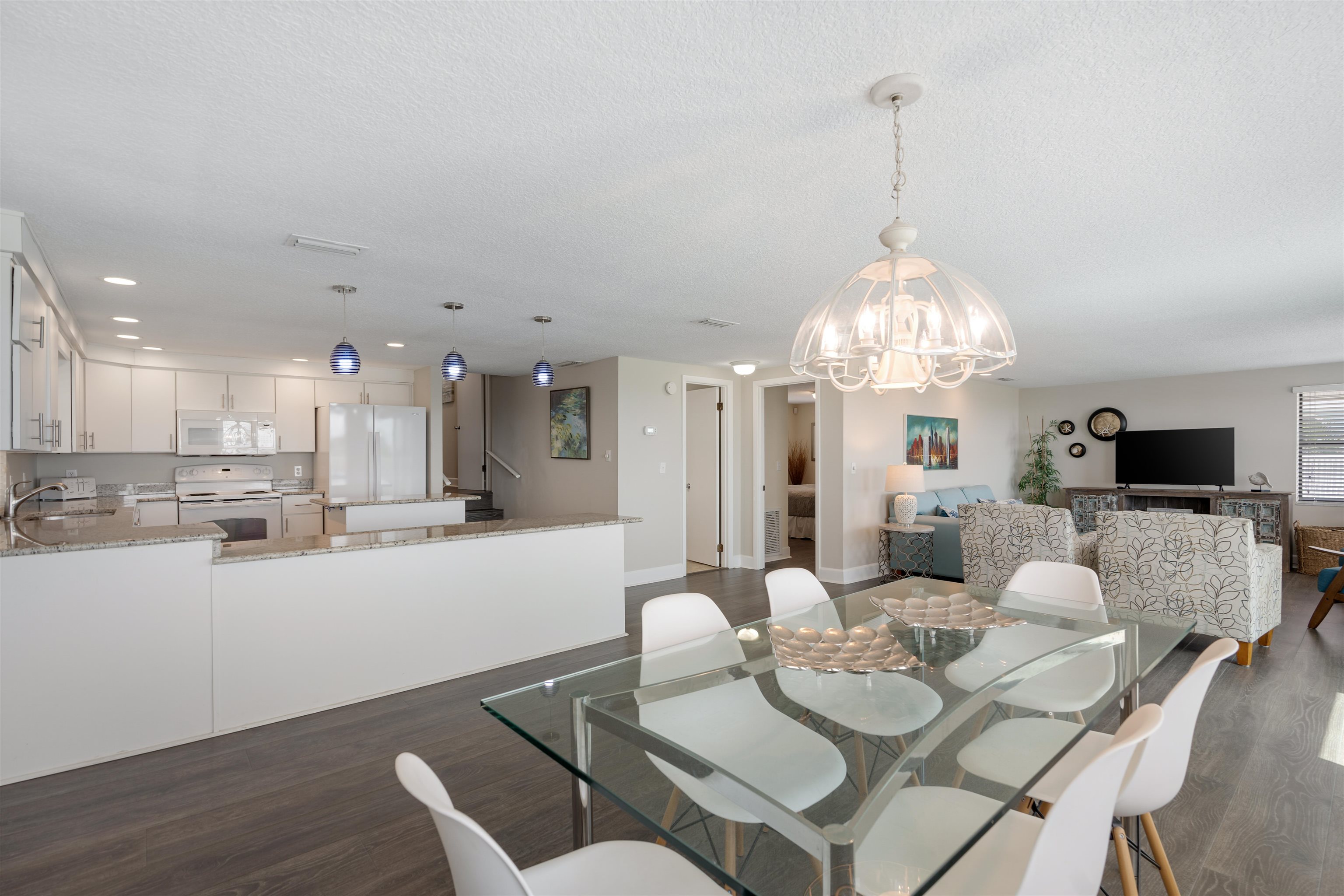 5424 Atlantic View St. Augustine, FL 32080 - Photo 12 of 42 a view of a dining room with furniture and chandelier