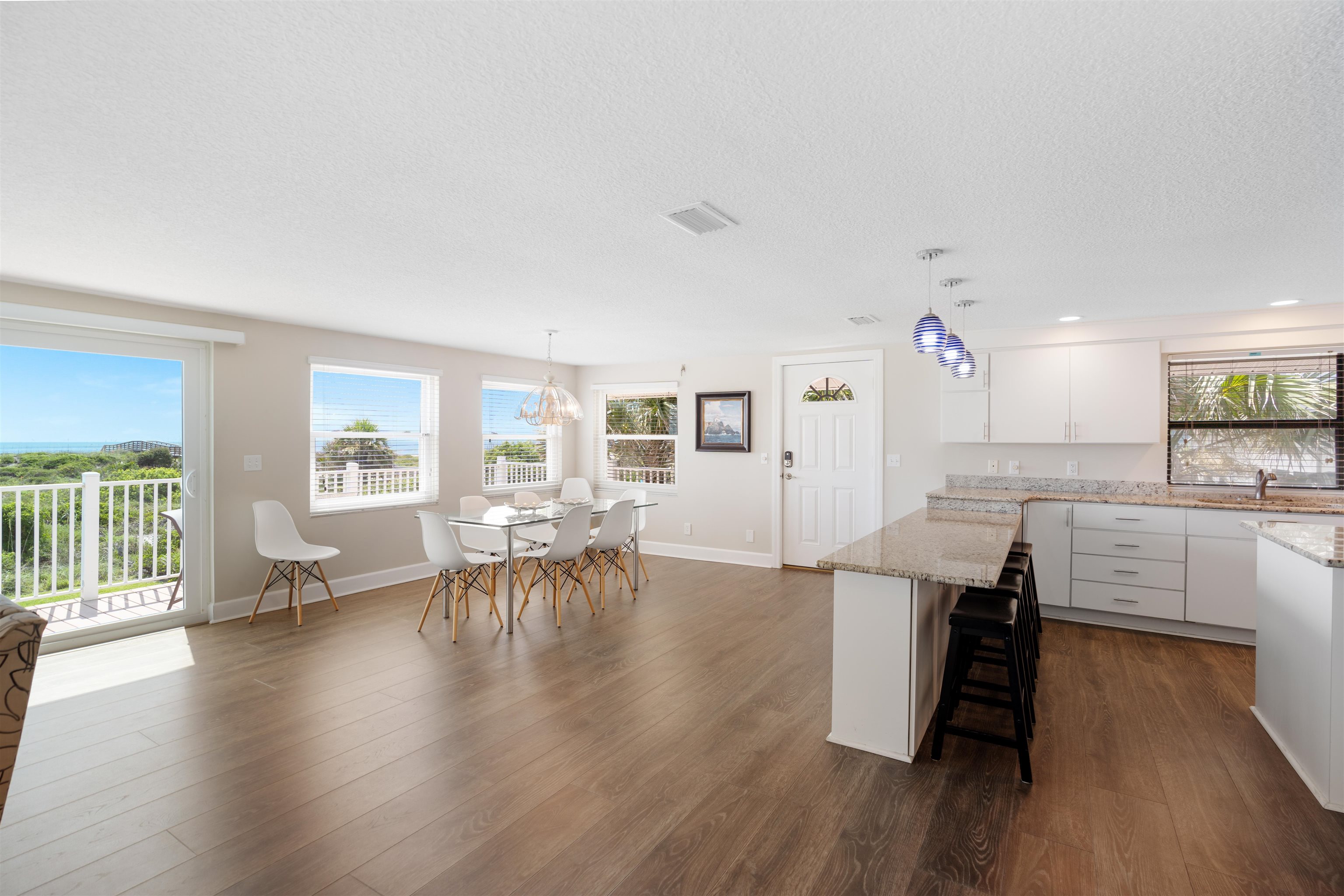 5424 Atlantic View St. Augustine, FL 32080 - Photo 13 of 42 a living room with furniture and a wooden floor